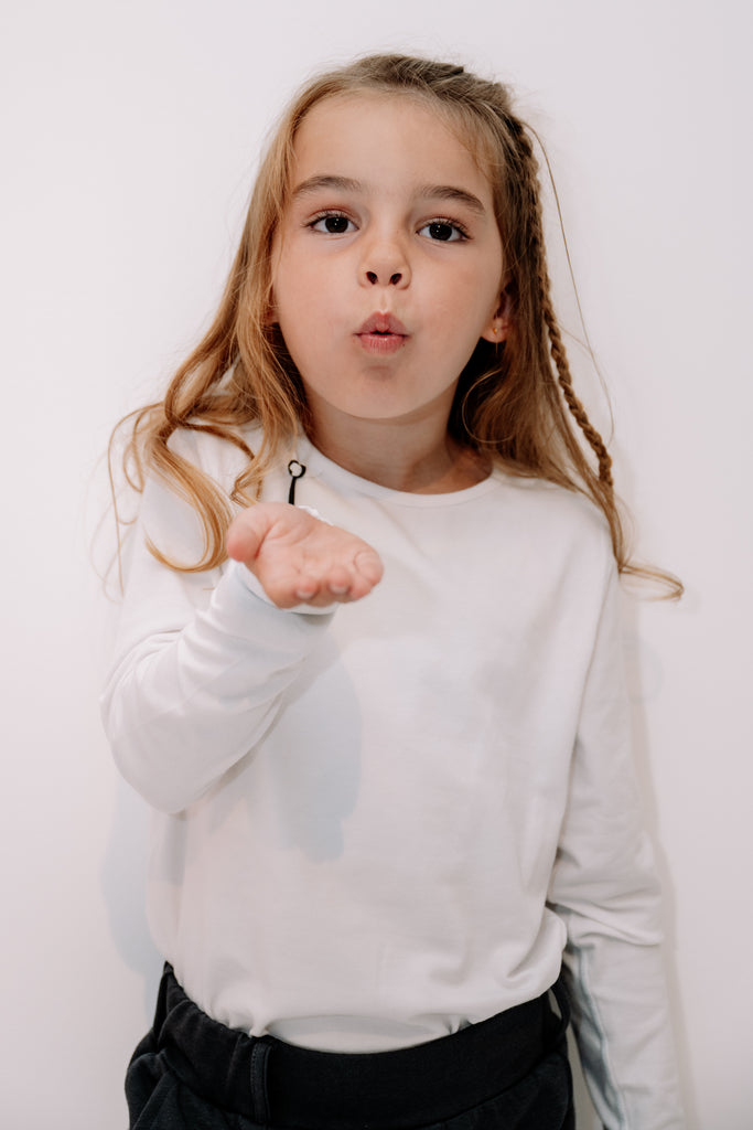 Long-sleeve white without seams or labels for ultimate sensory friendly comfort, perfect for children with sensitive skin or high sensory needs. Pair with SAM's ZEN chewy fidget for reduced stress and improved focus.
