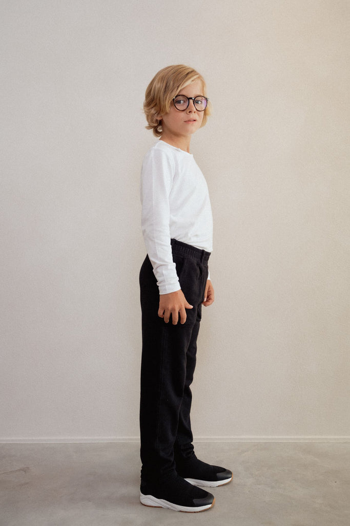 Long-sleeve white without seams or labels for ultimate sensory friendly comfort, perfect for children with sensitive skin or high sensory needs. Pair with SAM's ZEN chewy fidget for reduced stress and improved focus.