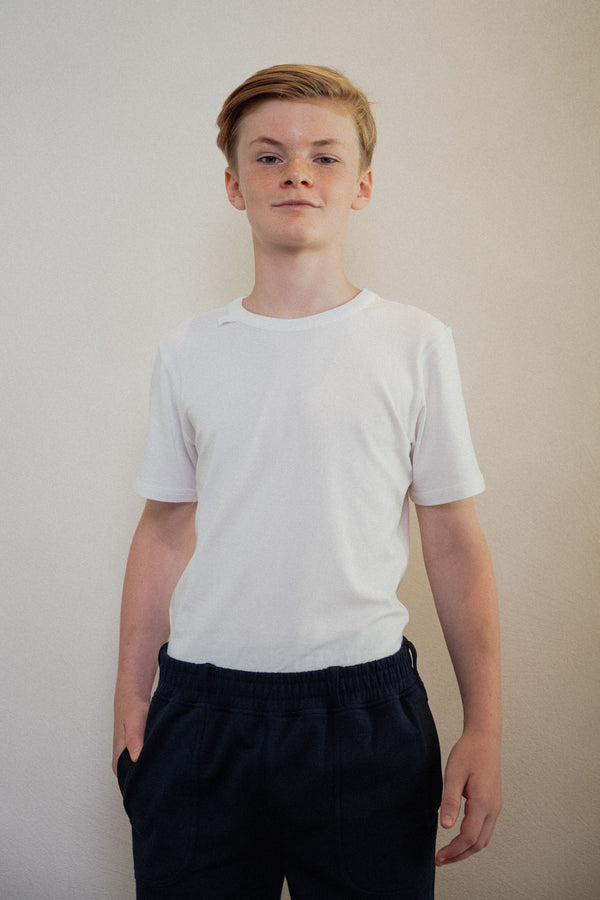 White sensory-friendly T-shirt with a seamless design, perfect for ultimate comfort and reduced irritation for sensory sensitive children and teens of kids with sensitive skin.
