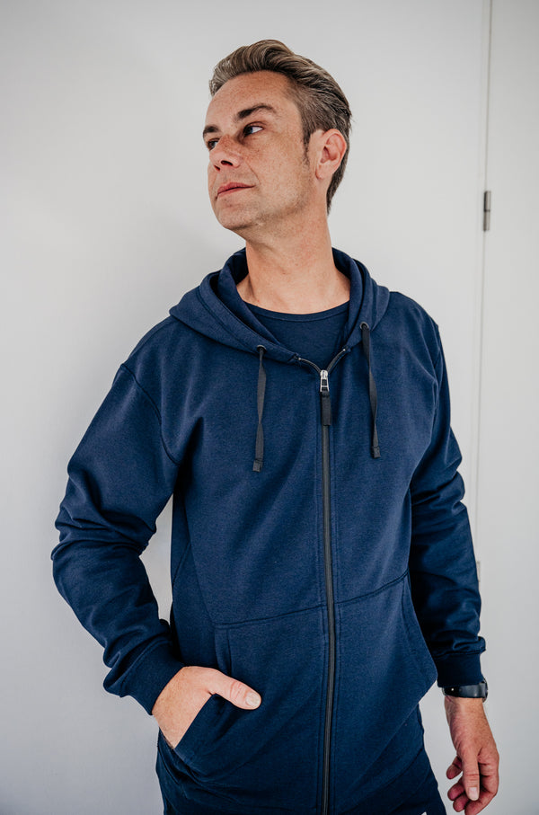 Soft fleece hoodie dark blue, designed for sensory comfort and stress reduction. This sensory-friendly hoodie features customizable fidget options, including discreet fidget pockets making it ideal for sensory sensitive individuals and people with autism, ADHD, stress seeking to manage sensory overload.