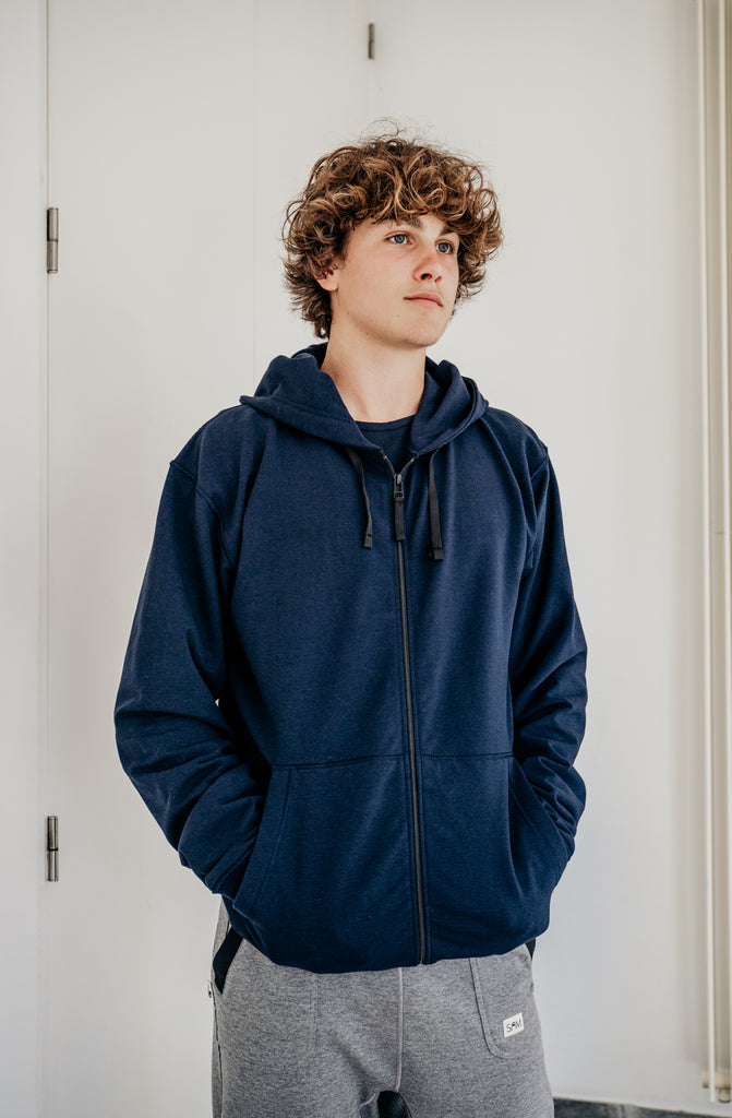 Soft fleece hoodie dark blue, designed for sensory comfort and stress reduction. This sensory-friendly hoodie features customizable fidget options, including discreet fidget pockets making it ideal for sensory sensitive individuals and people with autism, ADHD, stress seeking to manage sensory overload.