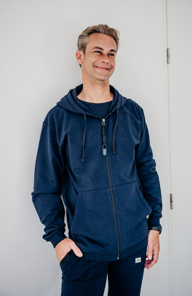 Soft fleece hoodie dark blue, designed for sensory comfort and stress reduction. This sensory-friendly hoodie features customizable fidget options, including discreet fidget pockets making it ideal for sensory sensitive individuals and people with autism, ADHD, stress seeking to manage sensory overload.