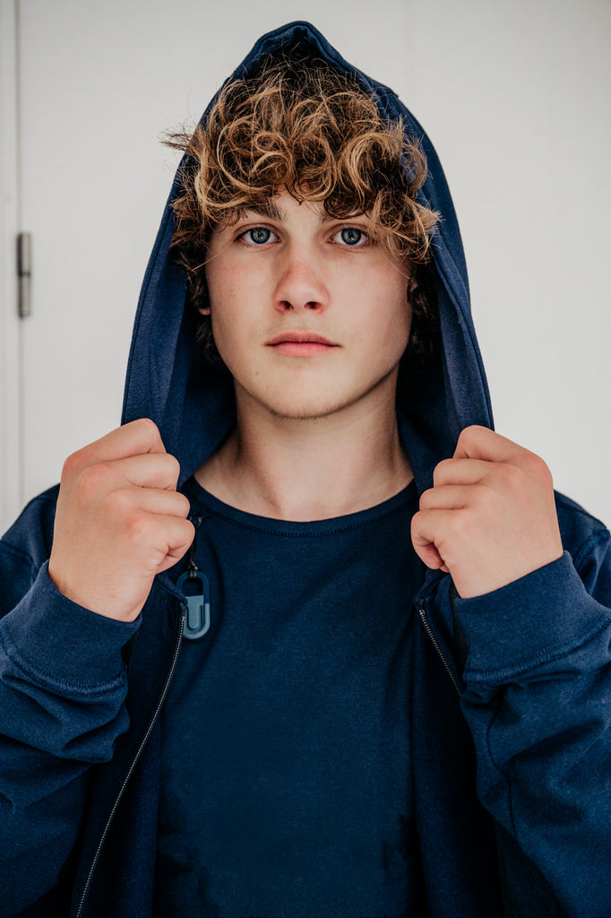 Soft fleece hoodie dark blue, designed for sensory comfort and stress reduction. This sensory-friendly hoodie features customizable fidget options, including discreet fidget pockets making it ideal for sensory sensitive individuals and people with autism, ADHD, stress seeking to manage sensory overload.