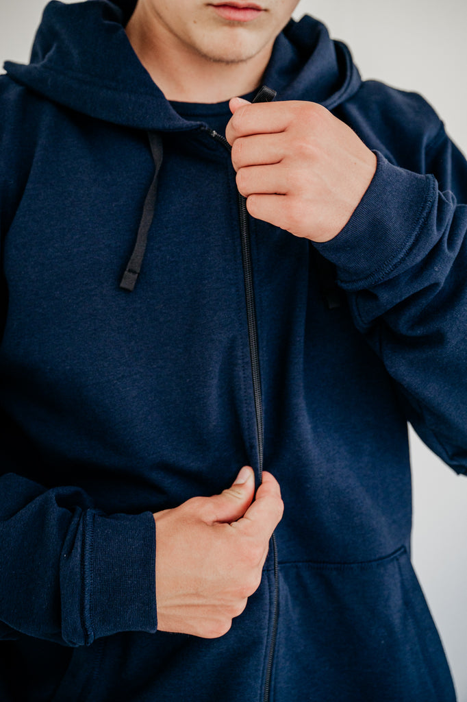 Soft fleece hoodie dark blue, designed for sensory comfort and stress reduction. This sensory-friendly hoodie features customizable fidget options, including discreet fidget pockets making it ideal for sensory sensitive individuals and people with autism, ADHD, stress seeking to manage sensory overload.