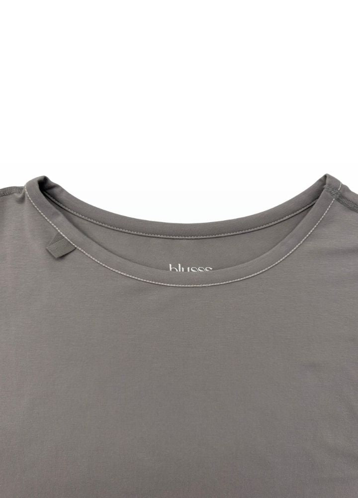Sensory friendly longsleeve for adults in stone grey, wider cut that hangs away from the body