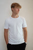 Sensory friendly seamless soft white T-shirt without labels or tags for sensory sensitive adults or people with sensitive skin.