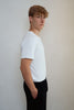 Sensory friendly seamless soft white T-shirt without labels or tags for sensory sensitive adults or people with sensitive skin.