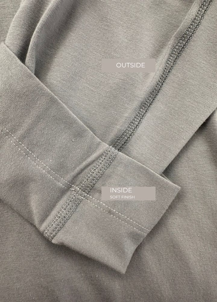 Sensory friendly longsleeve for adults in stone grey, wider cut that hangs away from the body