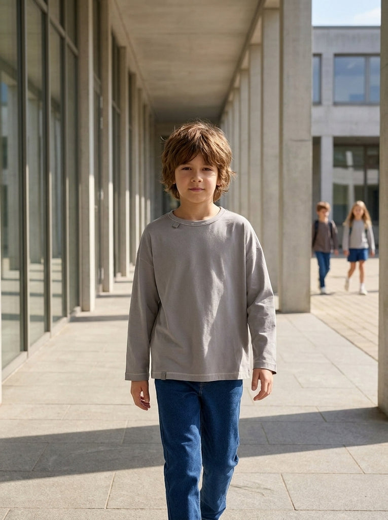Boy in a tagless loose-fit longsleeve for kids, no scratchy neck label, soft breathable bamboo cotton