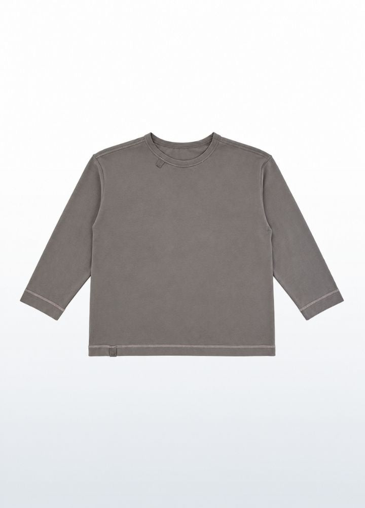 Stone grey boxy longsleeve for kids seen from the front, wide sensory friendly cut that does not cling