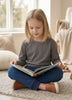 Girl using the collar fidget loop on the Blusss sensory longsleeve for extra sensory input