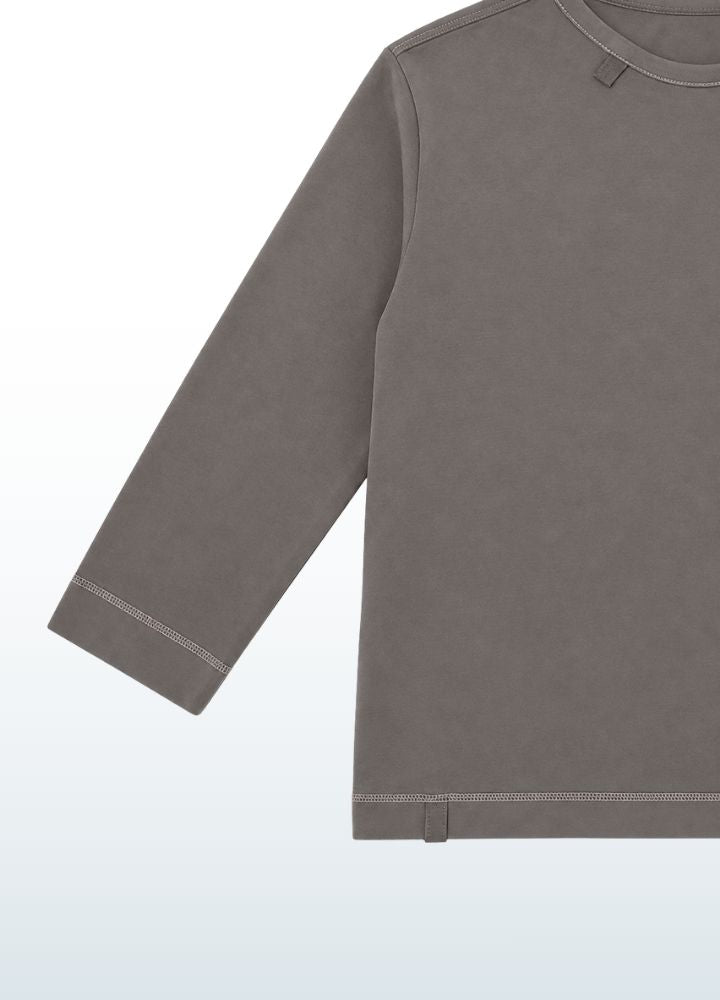 Close-up of flatlock seams sewn with soft thread, seamless feel on the kids sensory longsleeve